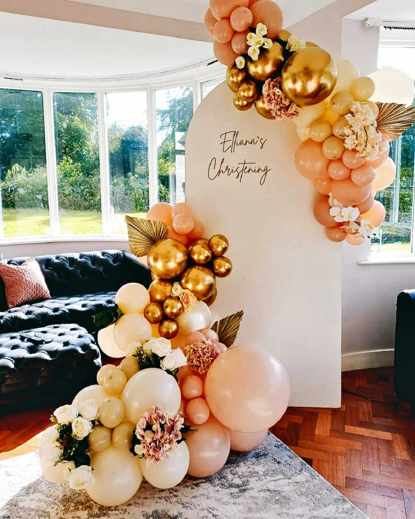 Elliana's Christening peach and gold balloon arch display